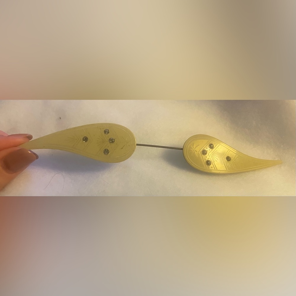 Antique celluloid cloak or scarf pin